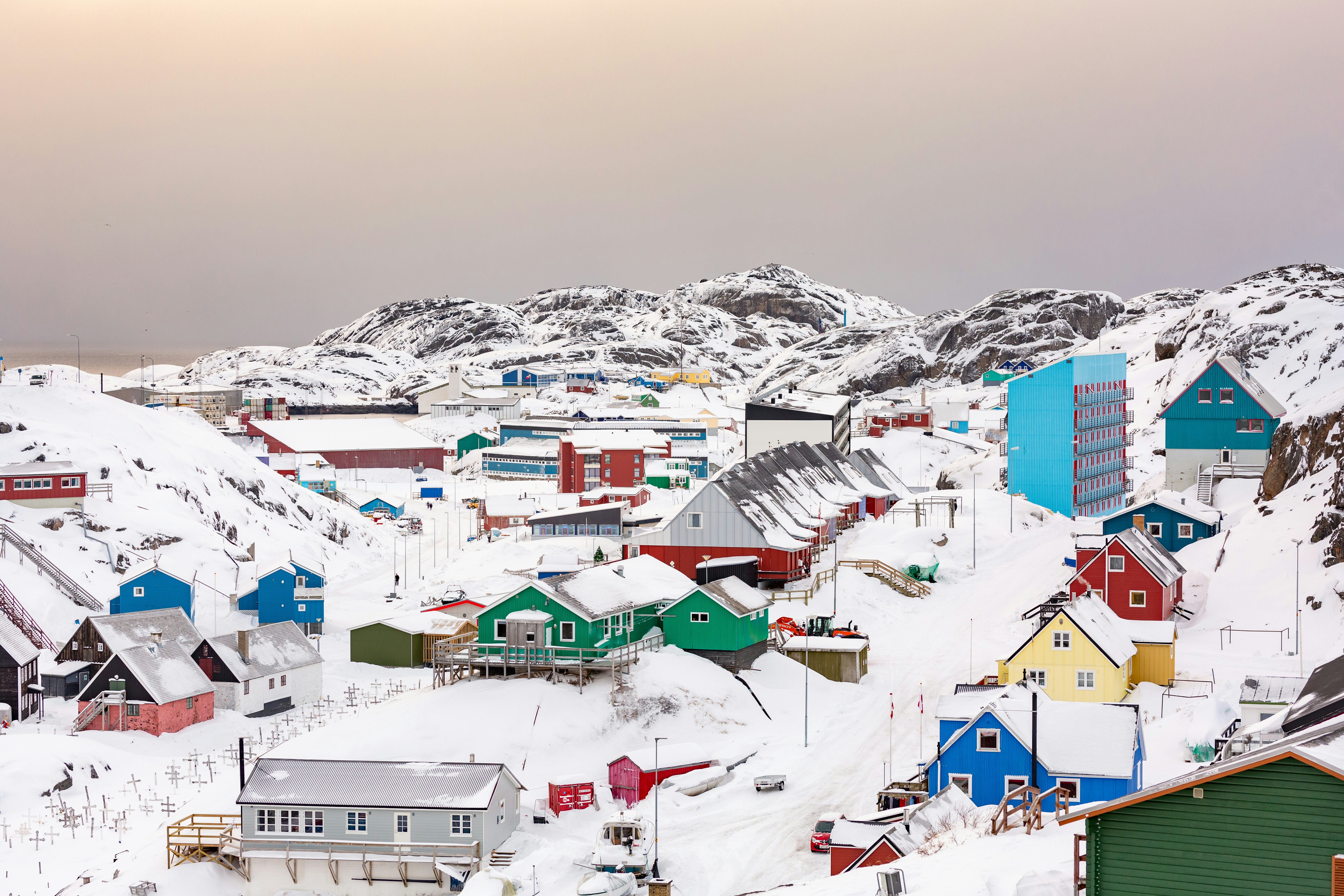 town on hill covered with snow