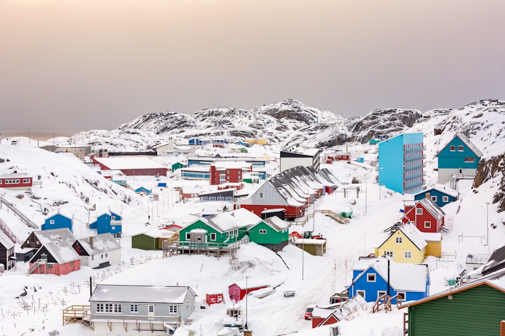 town on hill covered with snow