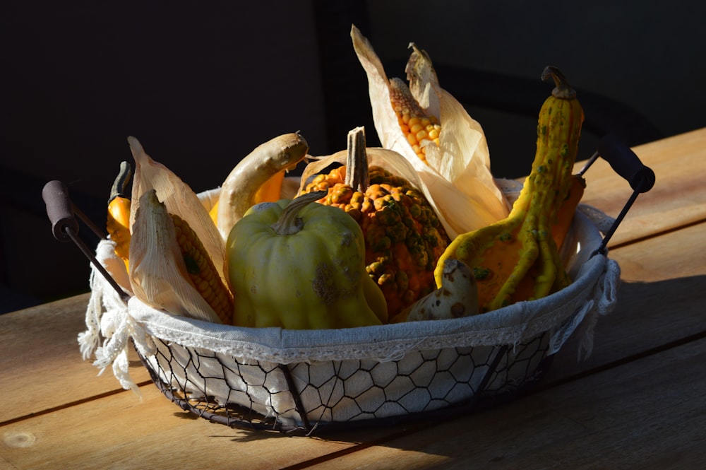 a basket filled with lots of different types of fruit