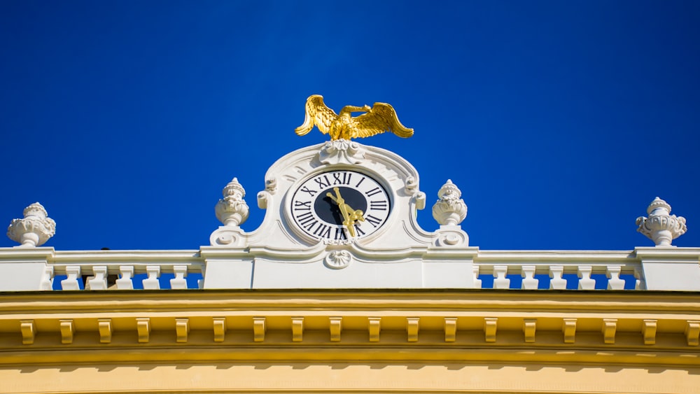 white framed analog clock during daytime