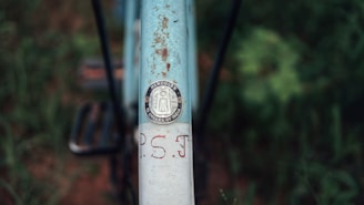 Close-up of a Hercules cycle’s sturdy frame and detailed branding under bright showroom lights.