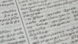Close-up of a detailed horoscope chart spread out with traditional Telugu script