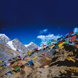 Colorful prayer flags fluttering against a backdrop of majestic peaks.
