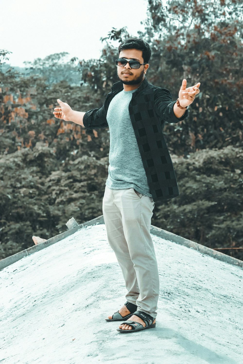 man standing on a roof