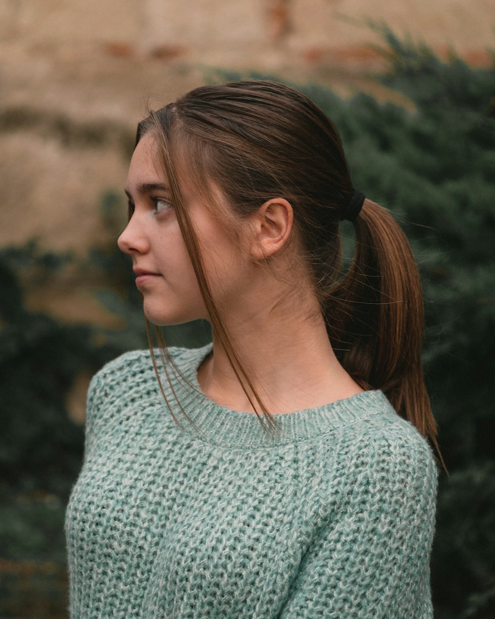 women's grey knit sweater during daytime