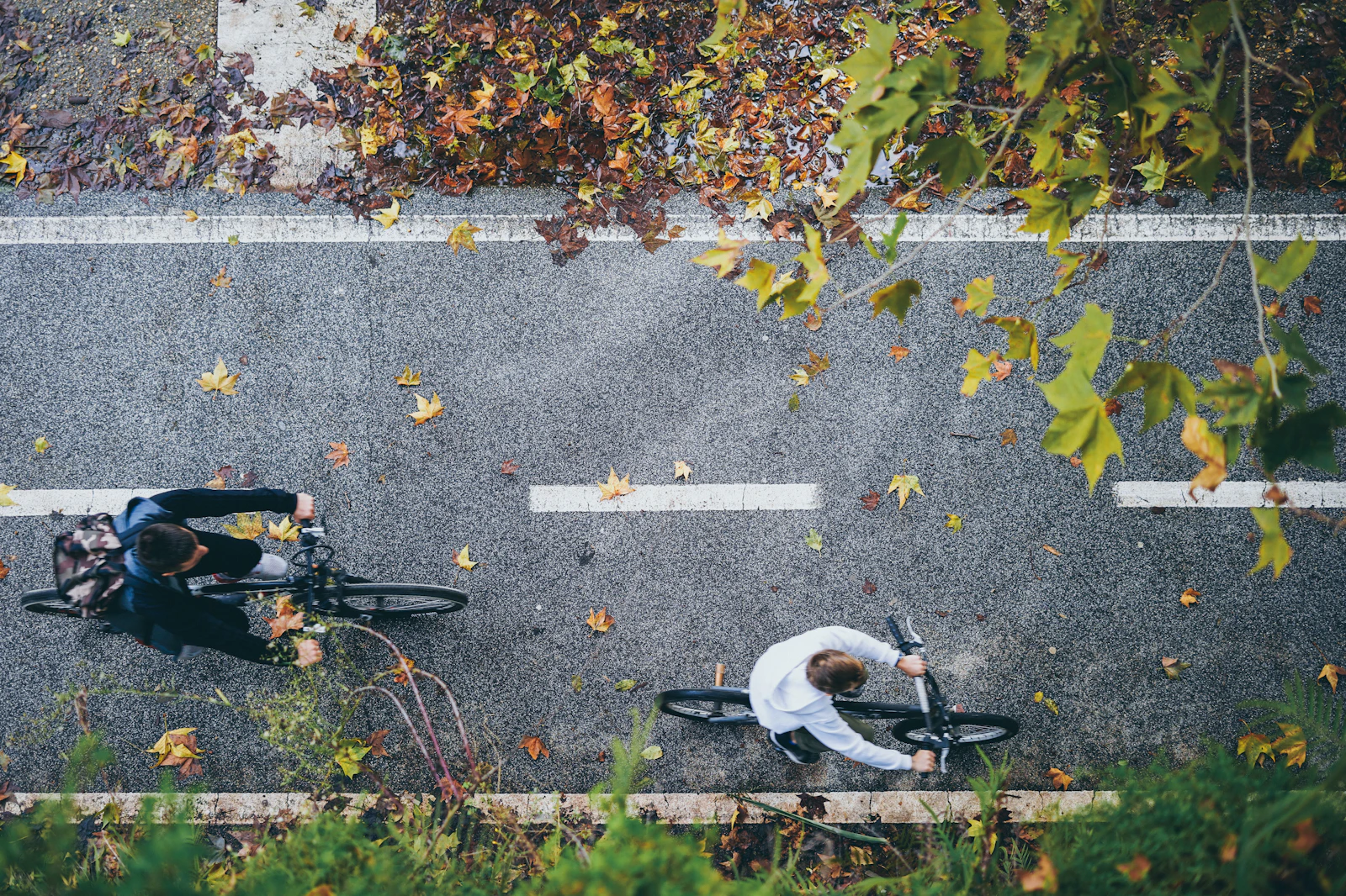 Cyclist aerial shot rolling through the city