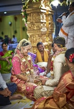 people gathering in wedding ceremony surrounded with people
