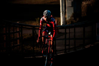 cyclist on road during golden hour