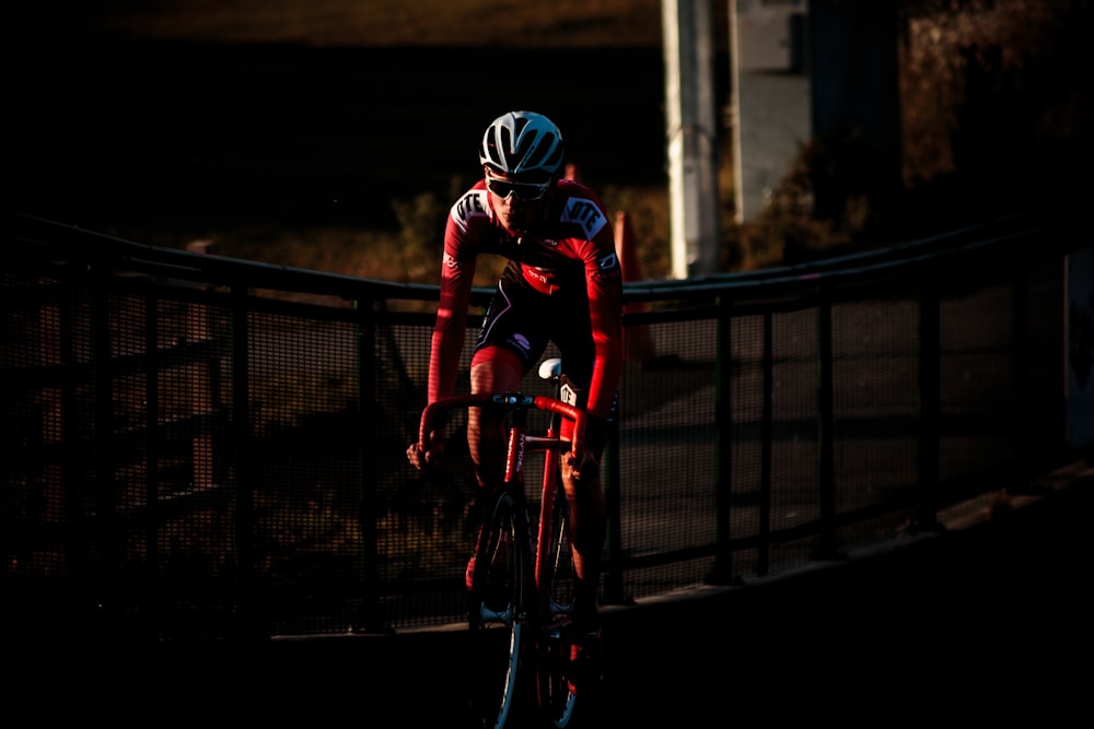 cyclist on road during golden hour