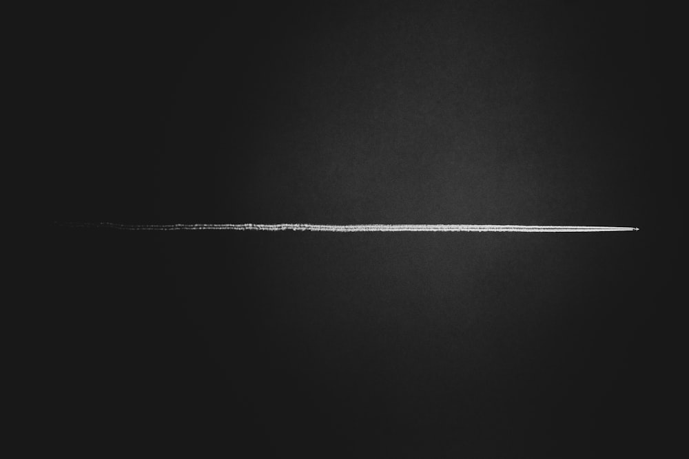 a black and white photo of a thin line