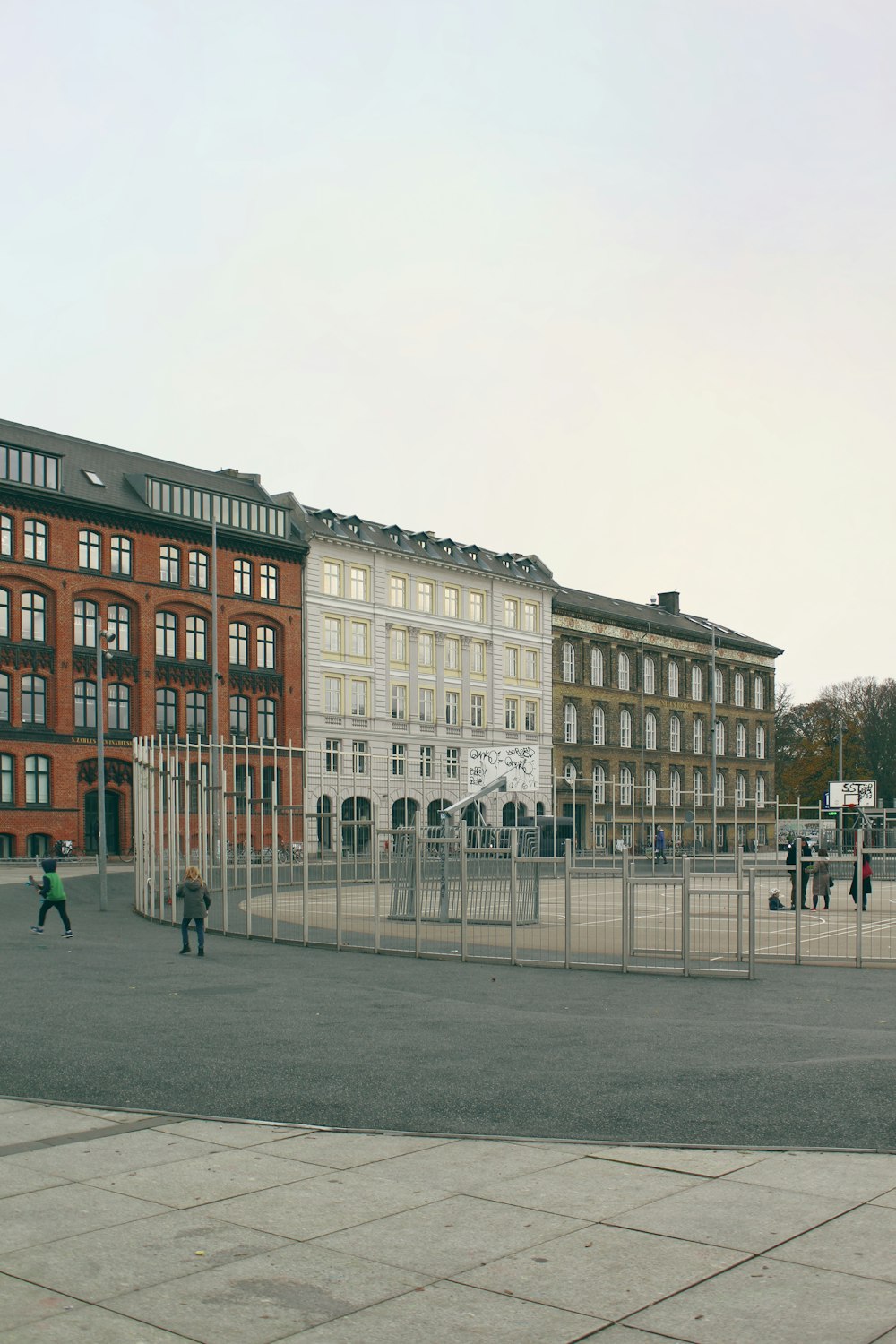 people near buildings during day