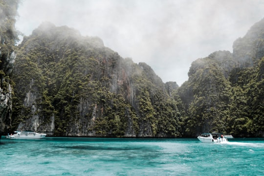 boats on body of water near mountains during day in Ko Phi Phi Lee Thailand