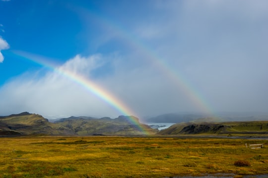 double rainbow over field at daytime in Sólheimajökull Iceland