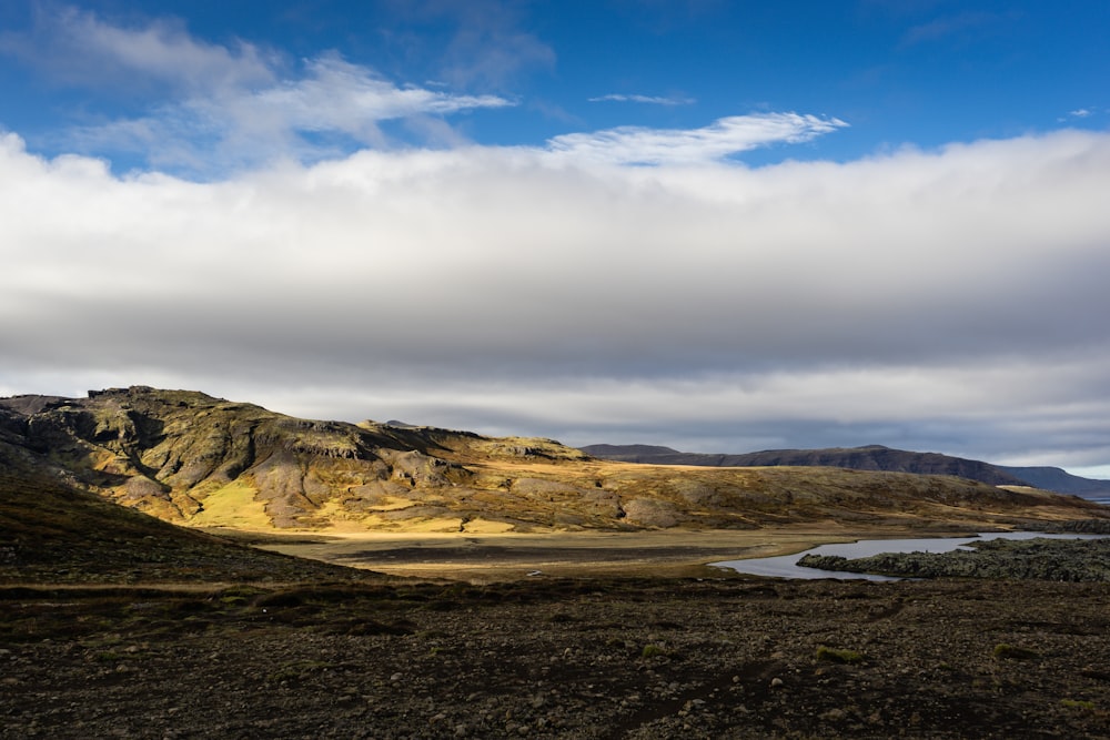 plains near mountain during daytime