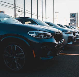 a row of cars parked in a parking lot