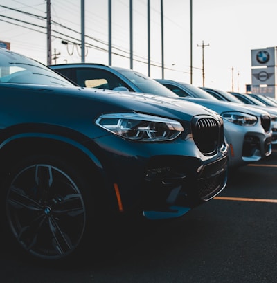 a row of cars parked in a parking lot