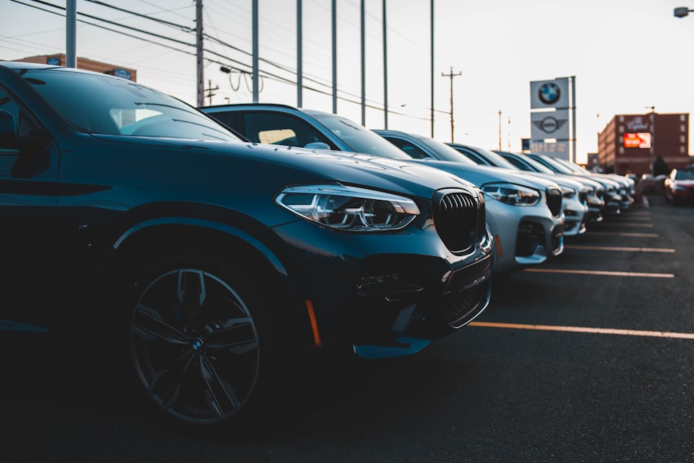 a row of cars parked in a parking lot