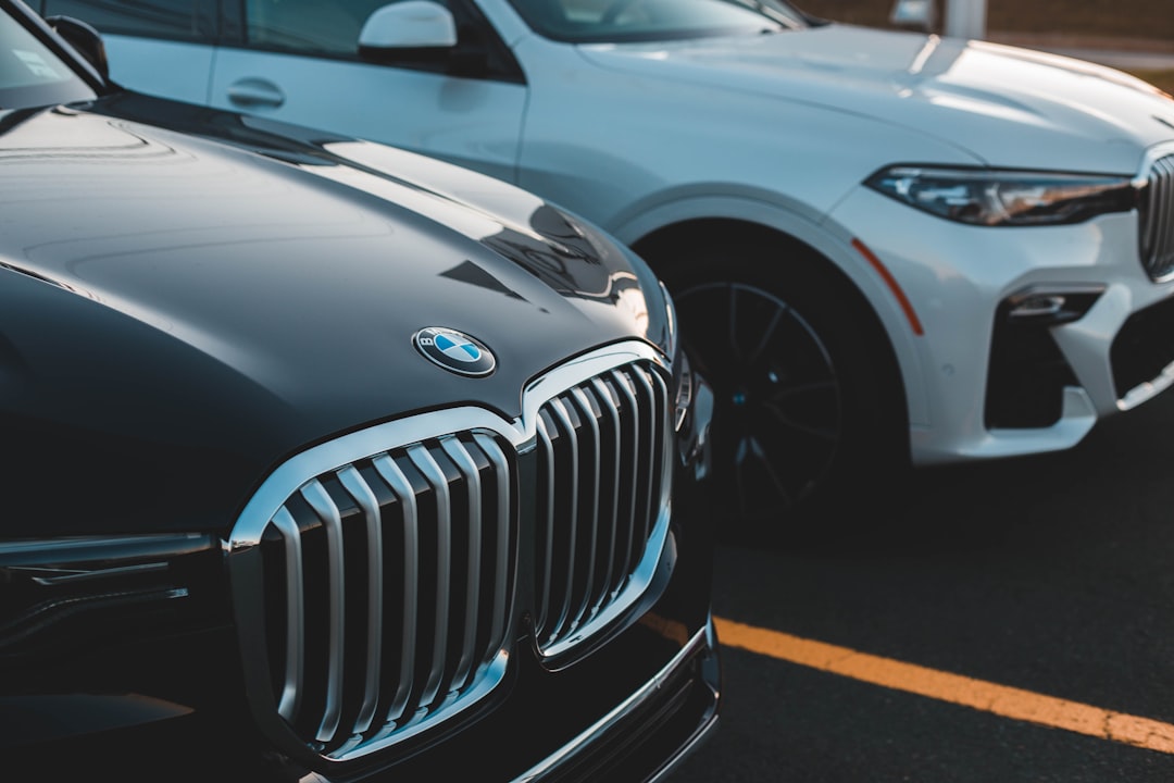 two parked black and white cars