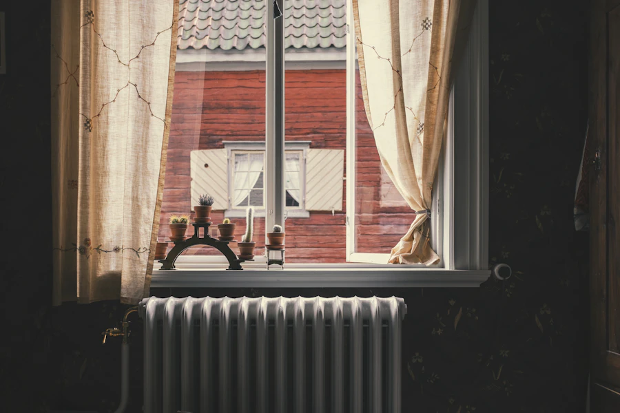 A radiator below a curtained window