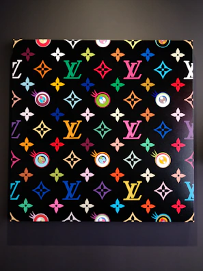 Canvas art with a modern twist on traditional Ghanaian symbols in bright blues and purples.