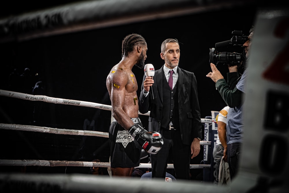 reporter interviewing boxer in ring