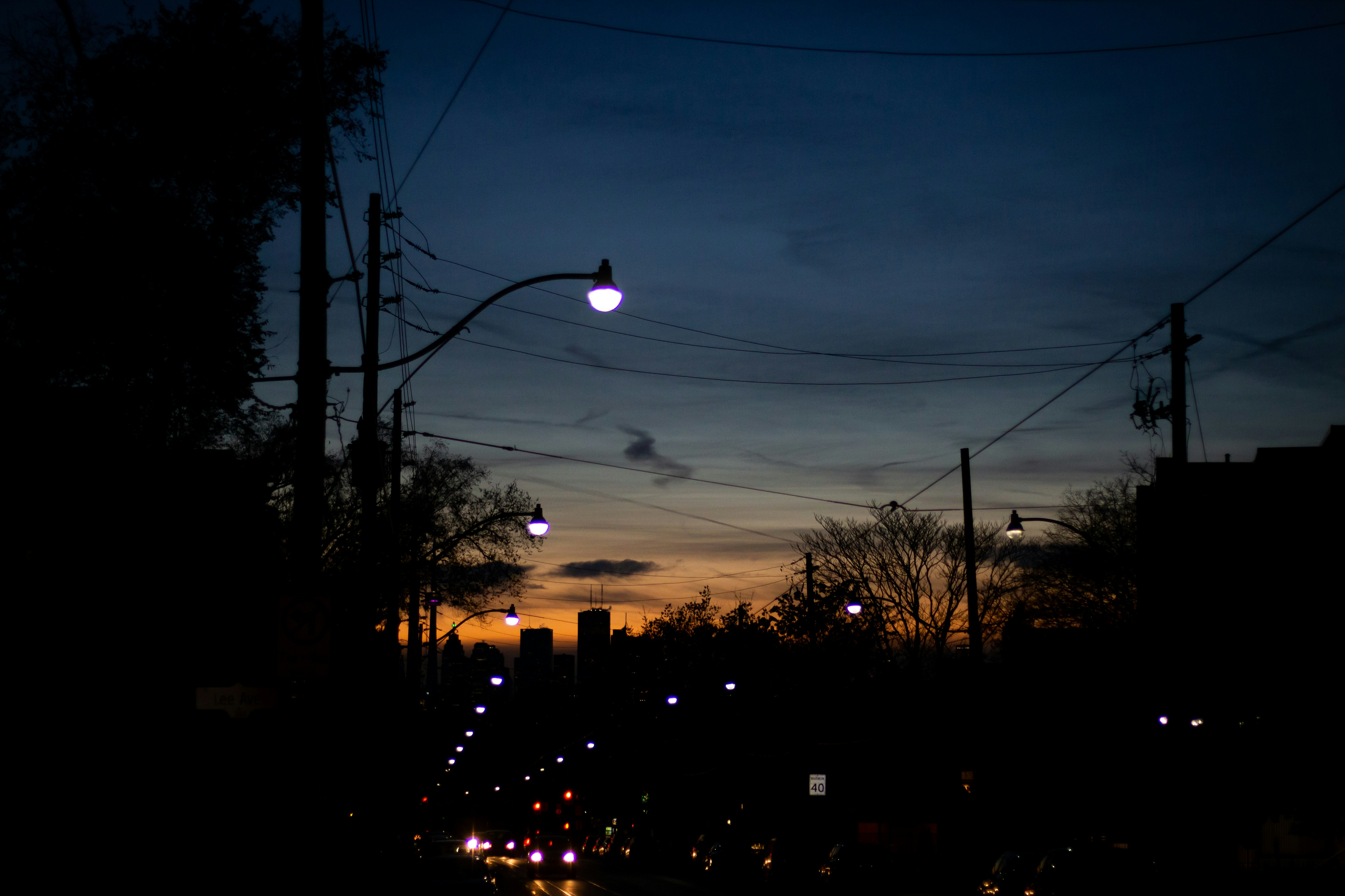 A city street at night with street lights photo – Free Grey Image on ...