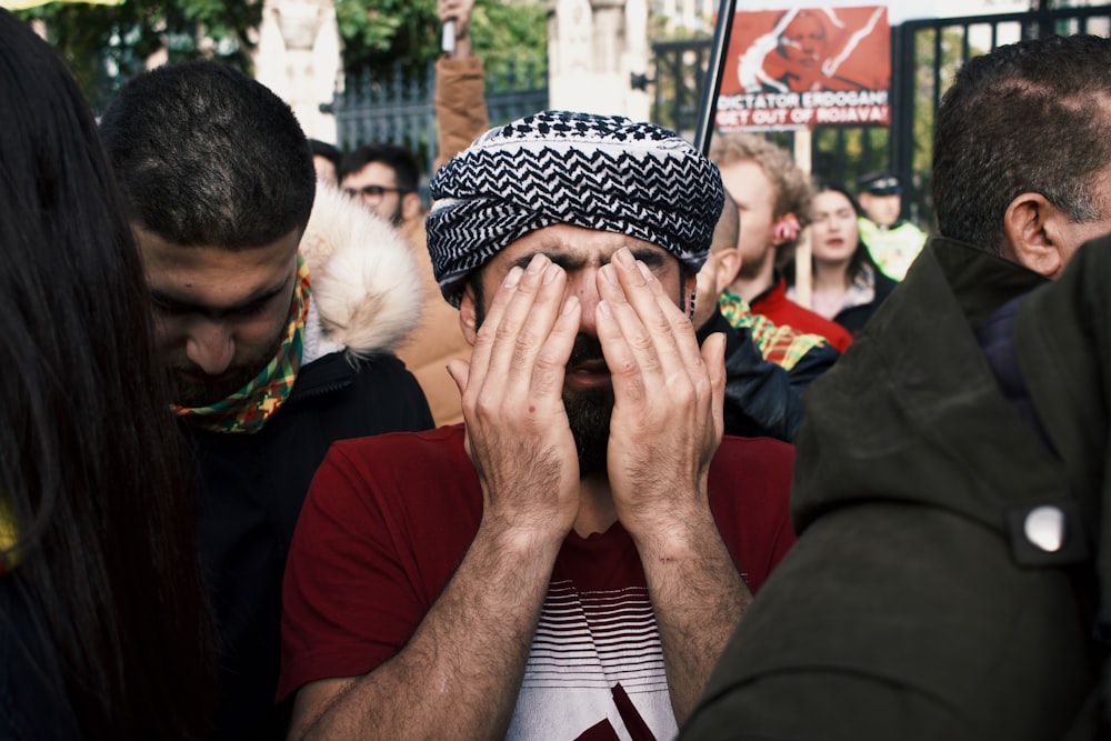 shallow focus photo of man in white and black headdress