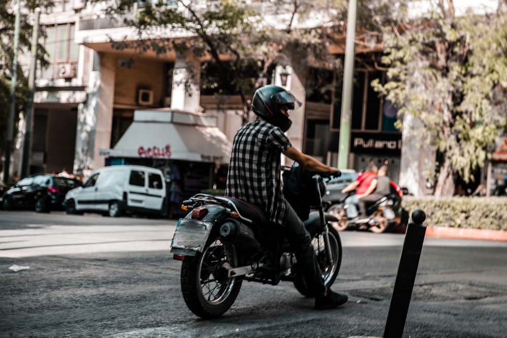 person riding on motorcycle during daytime