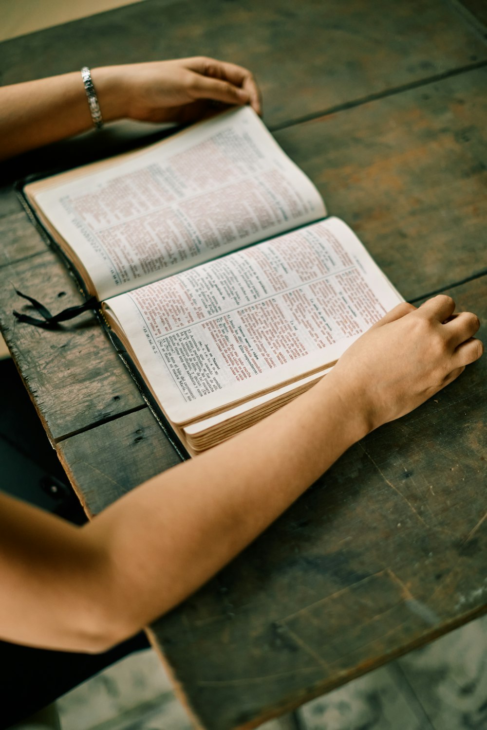 an open book on top of a wooden table