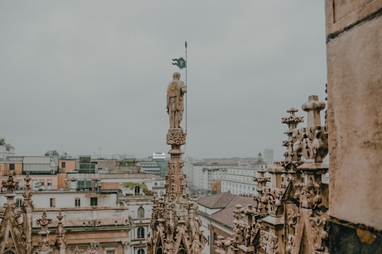 grey concrete buildings during daytime in Duomo di Milano Italy