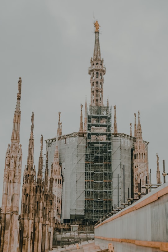 selective focus photography of building during daytime in Duomo di Milano Italy