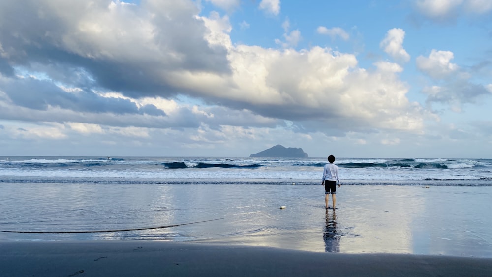 man standing by the seashore