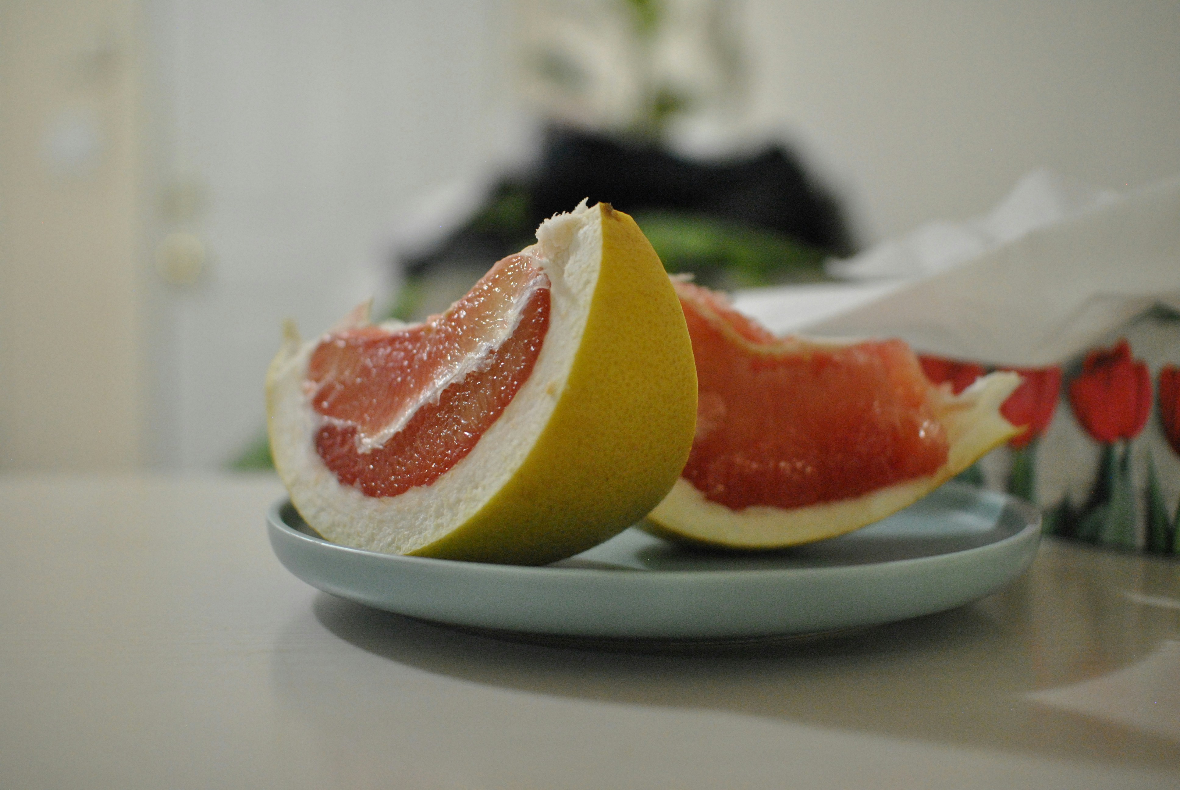 sliced ponkan fruits on plate produce zoom background