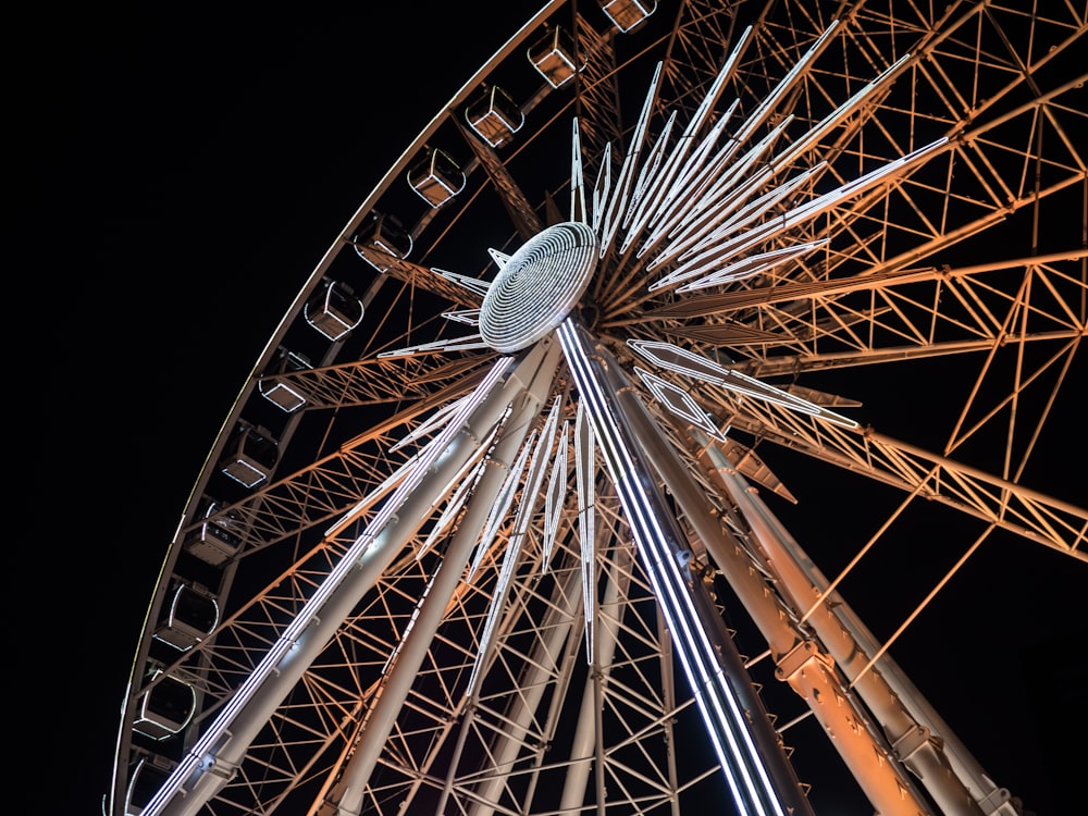 low-angle photography of brown and gray ferris wheel