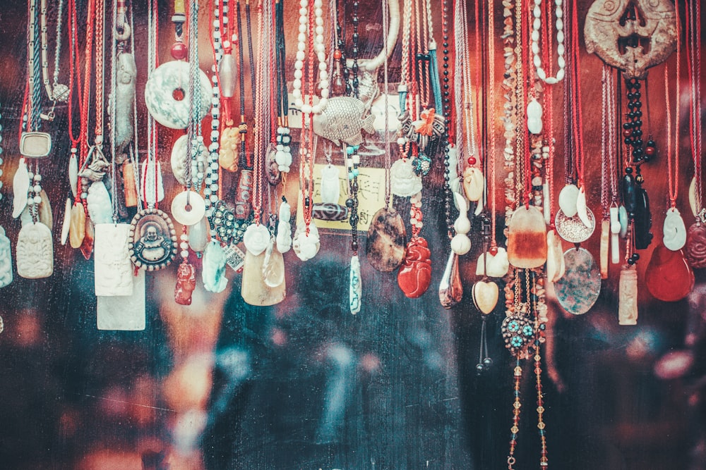 brown, white, and black beaded necklaces