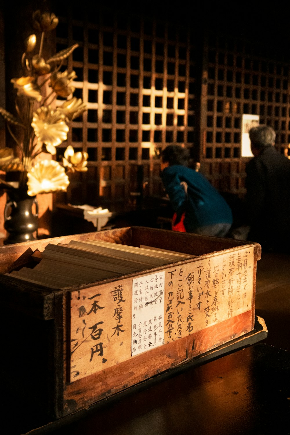 books inside a brown wooden box