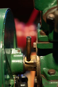Close-up of a mechanical seal installed on an industrial pump with blue and green accents.