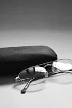 Elegant black and white photo of legal documents and a pair of glasses