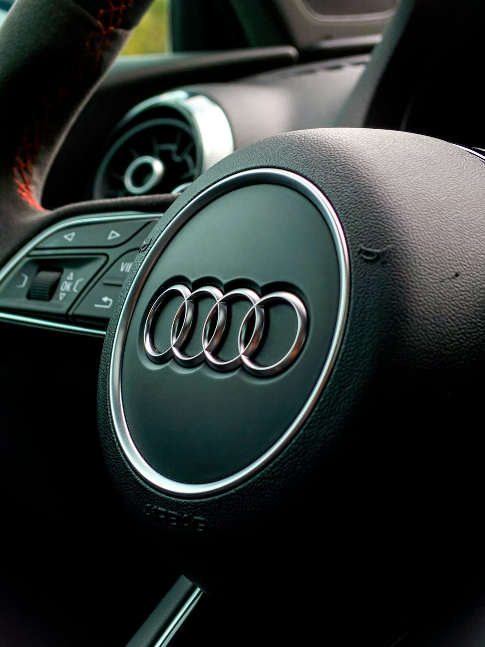 black Audi car steering wheel