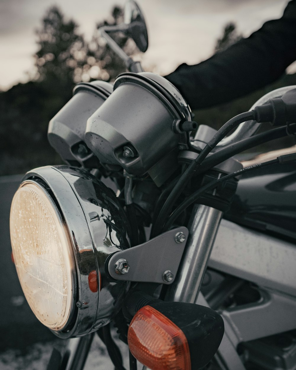 closeup photography of motorcycle headlight