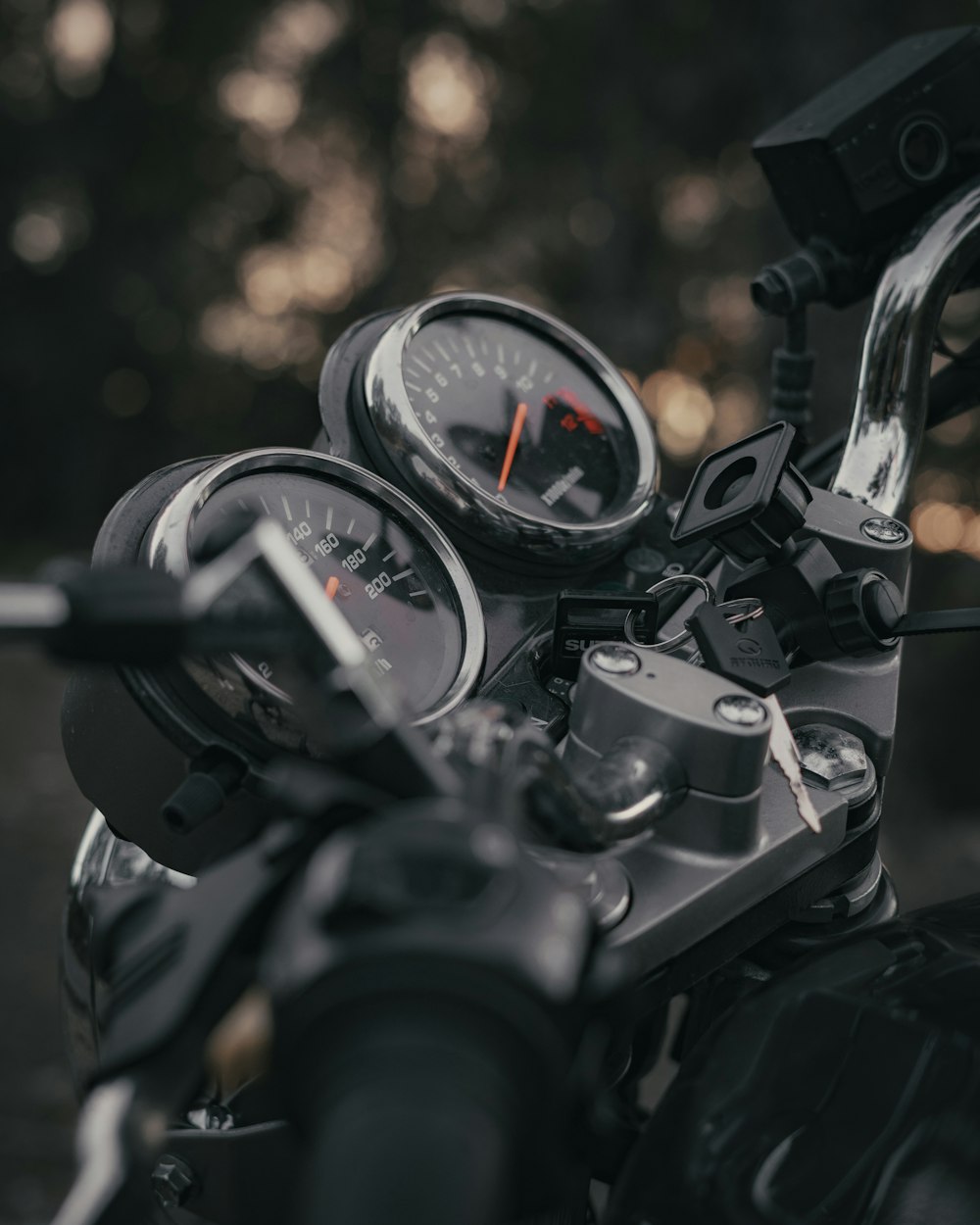 selective focus photography of motorcycle dashboard