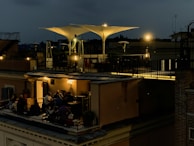 A rooftop terrace with modern seating and ambient lighting perfect for evening gatherings.