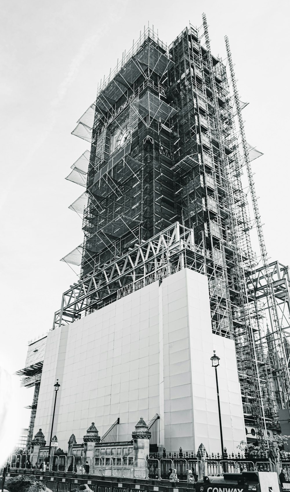 low-angle grayscale photography of an unfinished high-rise building
