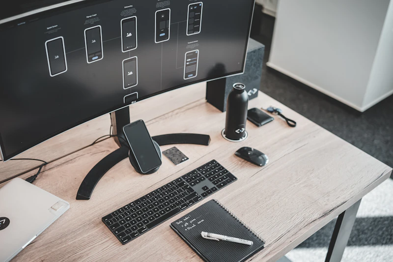 Professional workspace with warm ambient lighting and computer setup