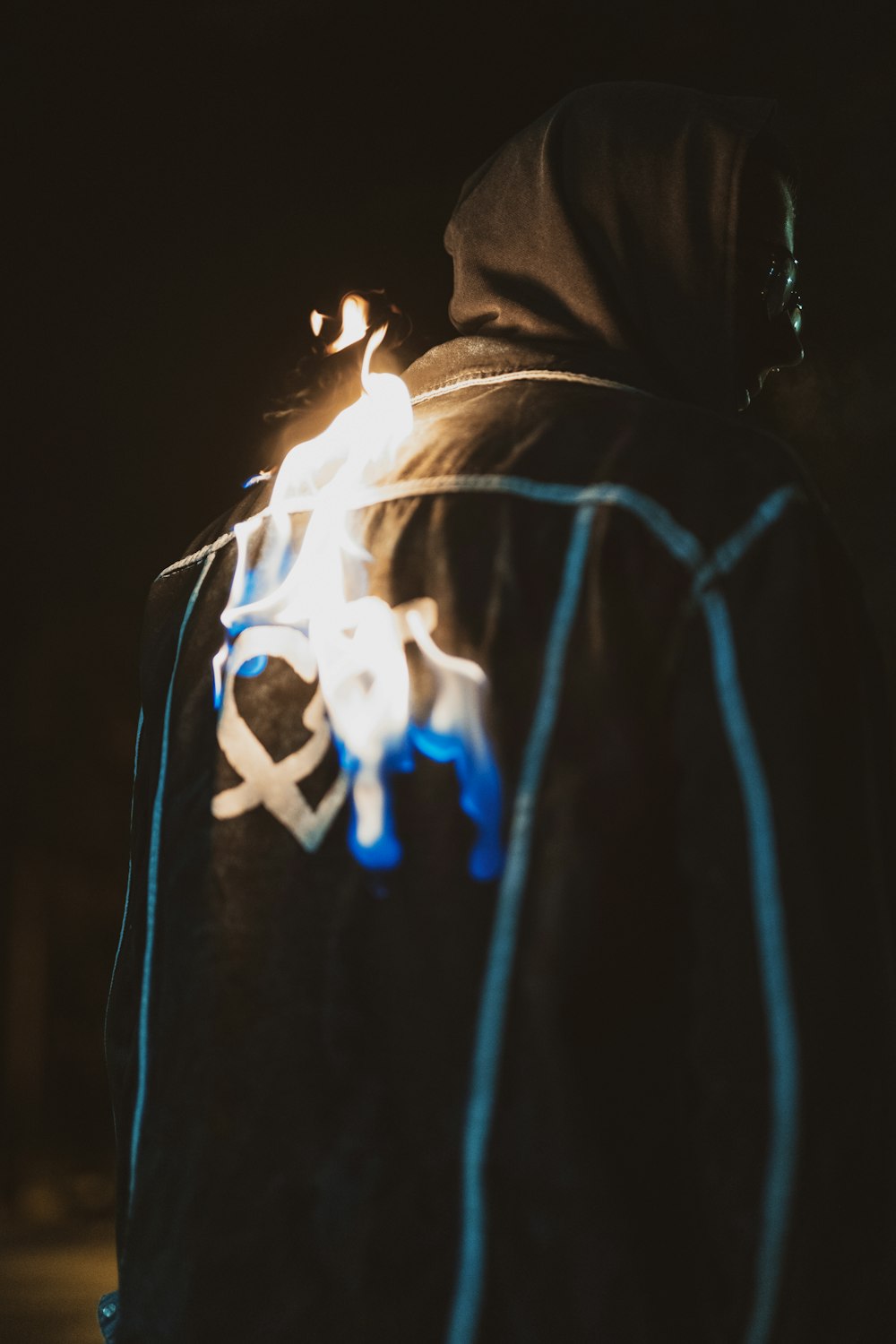 man wearing hoodie with fire