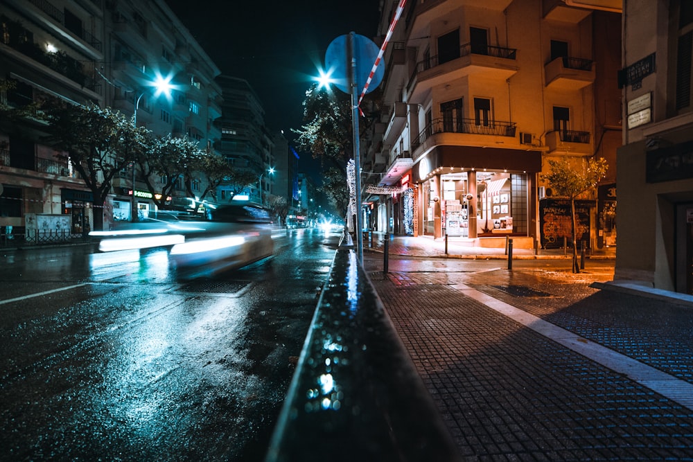 time lapse photography of road between high-rise buildings