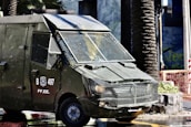 A vehicle equipped for security operations parked near a business facility.