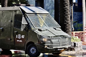 Mobile patrol vehicle with Pitbull VIP Protection branding cruising through a suburban neighborhood.
