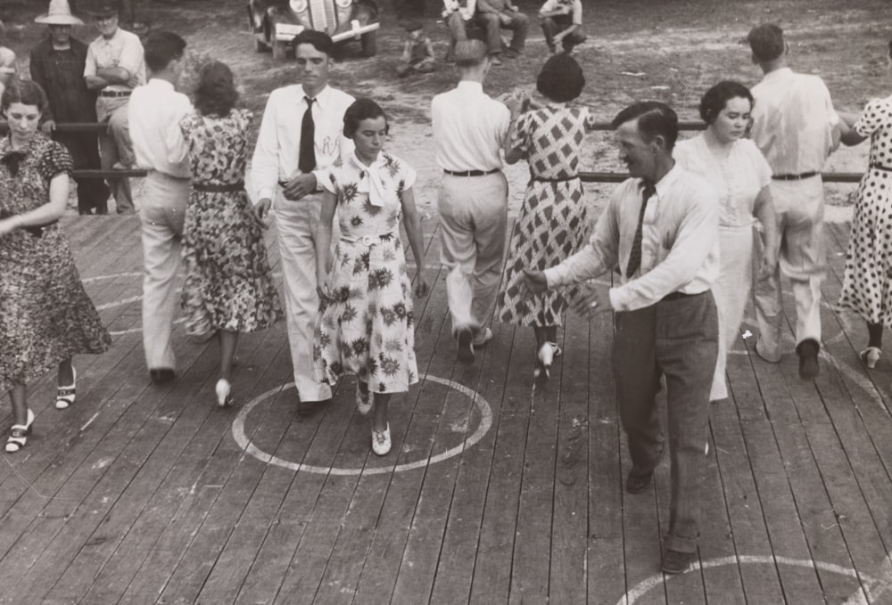 greyscale photo of dancing people