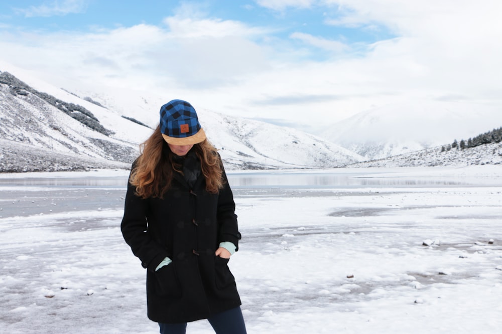 woman standing on a frozen body of water